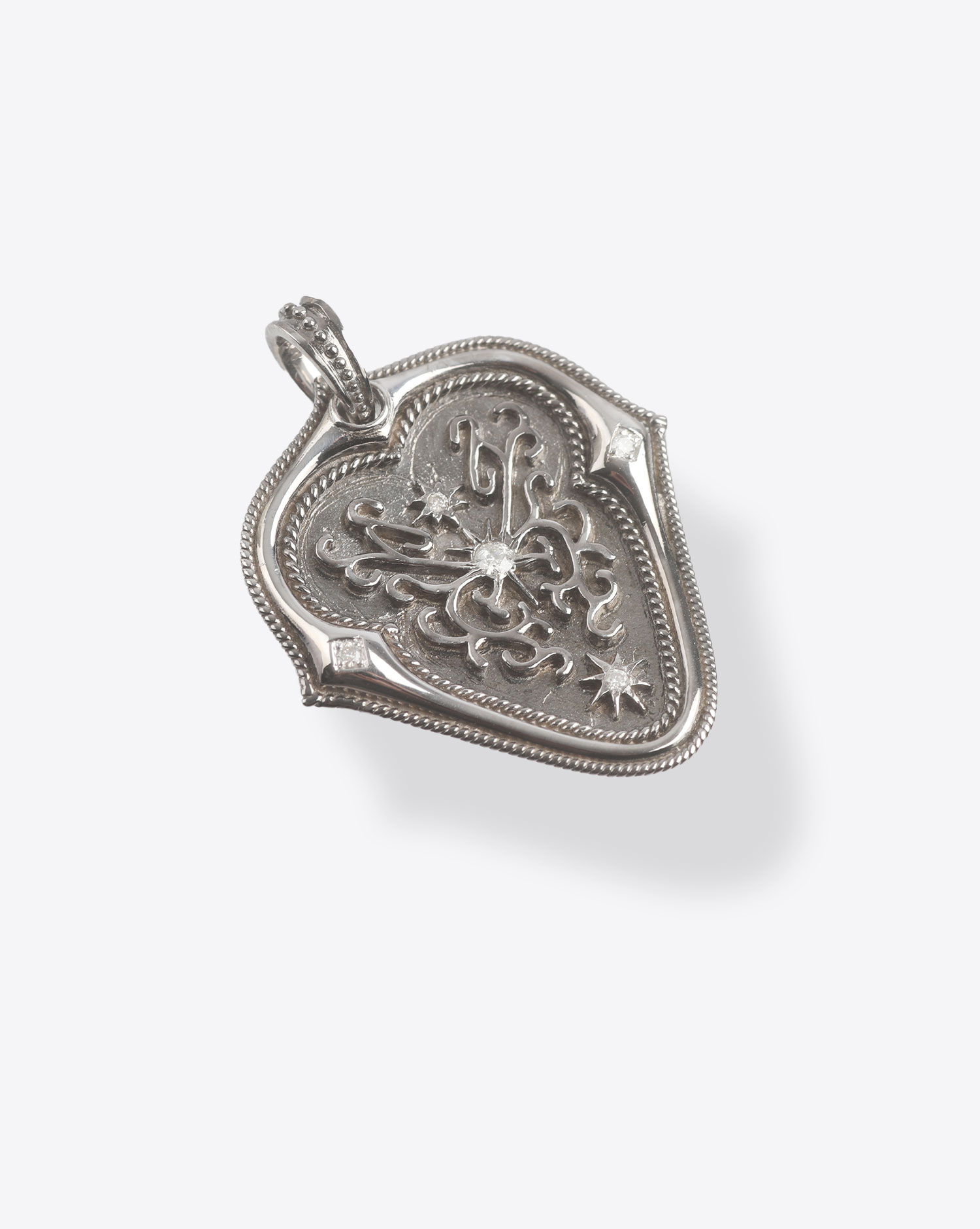 De Jaegher pendentif Médiator Tribute to Jimi en argent et diamants.  